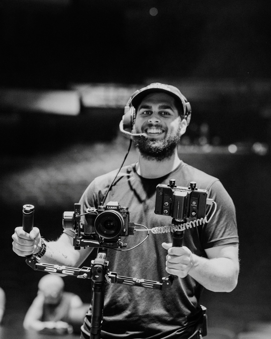 Cruz Hartman smiling with his camera and gimbal